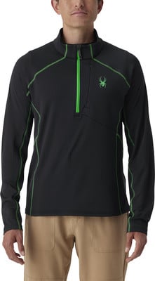 Schwarzes Sweatshirt mit grünem Reißverschluss und Spinnenlogo auf der Brust.