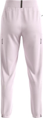 Hellrosa Sporthose mit Logo und Reißverschlüssen an den Beinen.