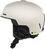 Ein beiger Skihelm mit schwarzen Details und Mips-Logo.