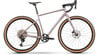 Rosa Gravelbike mit braunen Reifen und schwarzen Komponenten.