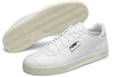 Biele tenisky Puma s gumovou podrážkou a logom značky. Biele tenisky Puma s gumovou podrážkou a logom značky.