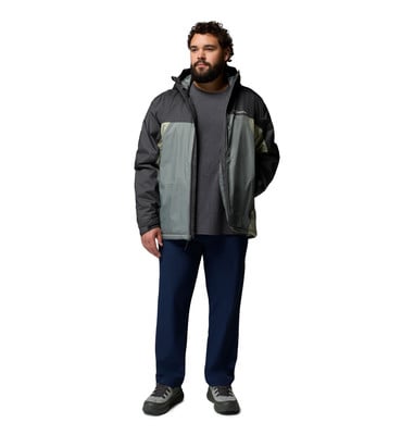 Ein Mann in einer dunklen Jacke, einem grauen T-Shirt und dunkelblauen Hosen. Ein Mann in einer dunklen Jacke, einem grauen T-Shirt und dunkelblauen Hosen.