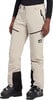 Damen-Skihose in Beige mit schwarzen Akzenten und Skischuhen.