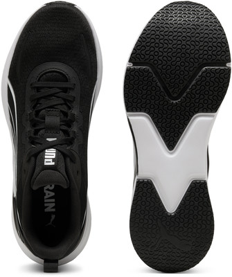 Schwarzer Puma-Sportschuh mit weißen Akzenten und Sohle. Schwarzer Puma-Sportschuh mit weißen Akzenten und Sohle.