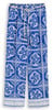 Kék nadrág fehér virágmintával és bézs színű zsinórral a derékrészen.