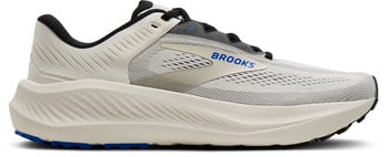 Beige Brooks Laufschuhe mit blauem Logo und schwarzen Details.