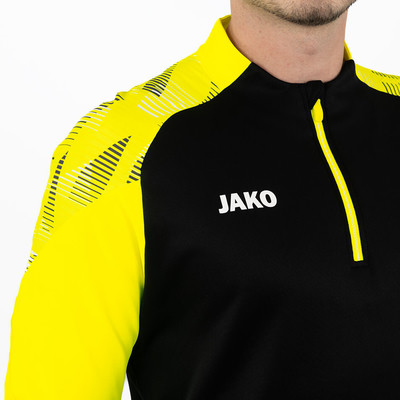 Schwarzes Sweatshirt mit gelben Ärmeln und JAKO Logo. Schwarzes Sweatshirt mit gelben Ärmeln und JAKO Logo.