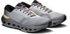 Graue Laufschuhe mit schwarzem Kragen und gelben Details an der Sohle.