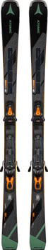 Atomic Redster-Ski mit Bindung sind schwarz mit grünen und orangefarbenen Akzenten.