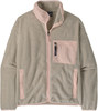 Eine beige Fleecejacke mit rosa Details und Reißverschluss.