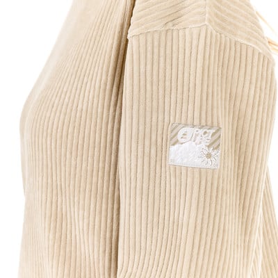 Beige Cordjacke mit Logo am Ärmel. Beige Cordjacke mit Logo am Ärmel.