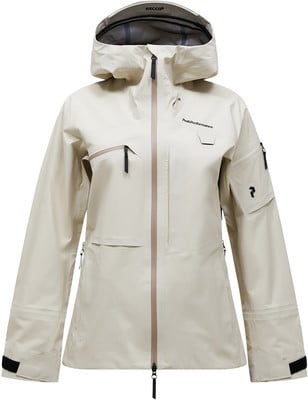 Eine beige Kapuzenjacke mit Peak Performance Logo, geeignet zum Skifahren. Eine beige Kapuzenjacke mit Peak Performance Logo, geeignet zum Skifahren.