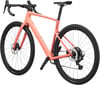Ein rosafarbenes Scott Gravelbike mit Scheibenbremsen und breiten Reifen.