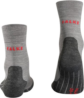 Graue Socken mit rotem Falke-Logo und dunkler Ferse. Graue Socken mit rotem Falke-Logo und dunkler Ferse.