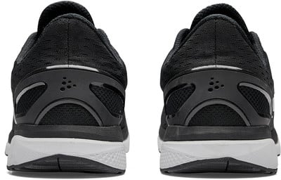 Rückansicht von schwarzen Laufschuhen mit weißer Sohle. Rückansicht von schwarzen Laufschuhen mit weißer Sohle.