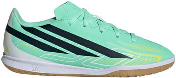 Grüner Adidas-Schuh mit dunkelblauen Streifen und gelben Akzenten für Geschwindigkeit.