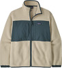 Beige Patagonia Fleecejacke mit dunkelblauem Einsatz.