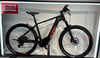 Schwarzes KTM E-Bike mit orangefarbenen Akzenten und Schriftzug.