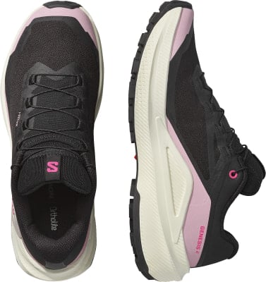 Schwarze Salomon Laufschuhe mit rosa Akzenten und weißer Sohle. Schwarze Salomon Laufschuhe mit rosa Akzenten und weißer Sohle.