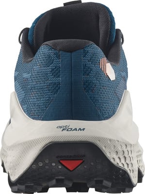 Rückansicht eines blauen Laufschuhs mit weißer Zwischensohle und schwarzer Laufsohle. Rückansicht eines blauen Laufschuhs mit weißer Zwischensohle und schwarzer Laufsohle.