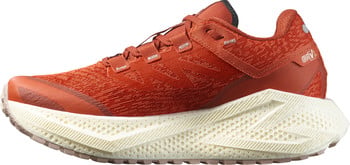 Orangener Laufschuh mit auffälliger weißer Sohle und strukturierter Oberseite.