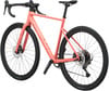 Ein rosafarbenes Scott Gravelbike mit schwarzen Reifen und Scheibenbremsen.