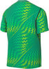 Grünes T-Shirt mit Zickzackmuster und optischer Täuschung.