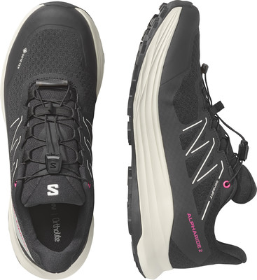 Schwarze Damen-Laufschuhe von Salomon mit weißer Sohle und rosa Details. Schwarze Damen-Laufschuhe von Salomon mit weißer Sohle und rosa Details.