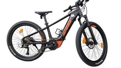 Ein schwarzes KTM E-Bike mit orangefarbenen Akzenten und Federung vorne. Ein schwarzes KTM E-Bike mit orangefarbenen Akzenten und Federung vorne.