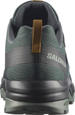 Grüner Herren-Wanderschuh von Salomon mit brauner Schlaufe hinten. Grüner Herren-Wanderschuh von Salomon mit brauner Schlaufe hinten.
