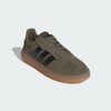 Zelené tenisky Adidas se třemi černými pruhy a gumovou podrážkou.