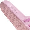 Pinker Adidas-Schuh mit Logo und Glitzerstreifen.