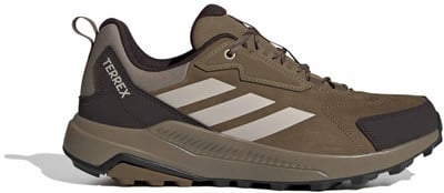 Hnědá outdoorová obuv Adidas Terrex s béžovými pruhy a tmavým detailem. Hnědá outdoorová obuv Adidas Terrex s béžovými pruhy a tmavým detailem.