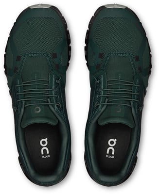 Ein Paar dunkelgrüne Laufschuhe mit weißem Logo auf der Innensohle. Ein Paar dunkelgrüne Laufschuhe mit weißem Logo auf der Innensohle.