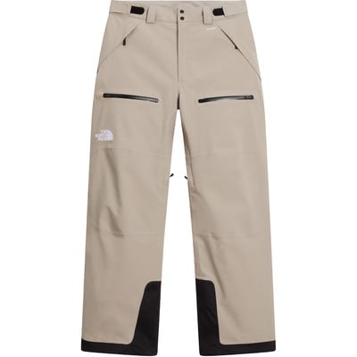 Beige Skihose von The North Face mit schwarzen Reißverschlüssen und Logo. Beige Skihose von The North Face mit schwarzen Reißverschlüssen und Logo.