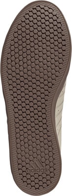 Braune Adidas Sneaker Sohle mit Kreisprofil und Logo. Braune Adidas Sneaker Sohle mit Kreisprofil und Logo.