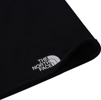 Eine schwarze Mütze von The North Face mit weißem Logo am Rand. Eine schwarze Mütze von The North Face mit weißem Logo am Rand.
