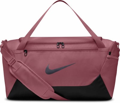 Eine rosafarbene Nike Sporttasche mit Logo und Umhängetasche. Eine rosafarbene Nike Sporttasche mit Logo und Umhängetasche.
