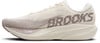 Ein beiger Brooks-Laufschuh mit lila Logo und Streifenmuster.