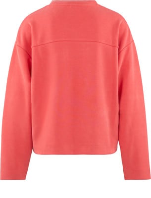 Ein rosafarbener Pullover mit langen Ärmeln und Rundhalsausschnitt. Ein rosafarbener Pullover mit langen Ärmeln und Rundhalsausschnitt.