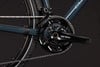 Detailaufnahme von Fahrradkurbeln und Kette mit GRX-Logo.
