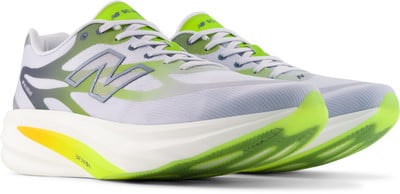 Weiße Laufschuhe mit neongrünen und grauen Details und großem N-Logo. Weiße Laufschuhe mit neongrünen und grauen Details und großem N-Logo.