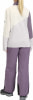 Mädchen in Skibekleidung, Rückansicht, mit Langarmshirt und Hose.
