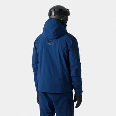Ein Mann in einer blauen Skijacke und einem Helm mit Brille, von hinten gezeigt. Ein Mann in einer blauen Skijacke und einem Helm mit Brille, von hinten gezeigt.
