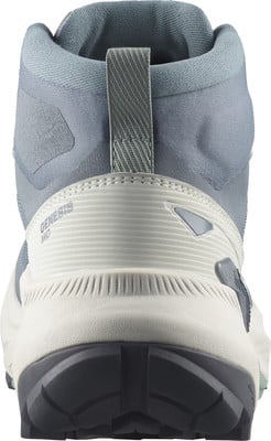 Rückansicht eines hellblauen und beige Damenschuhs für Wandern mit der Aufschrift Genesis Mid. Rückansicht eines hellblauen und beige Damenschuhs für Wandern mit der Aufschrift Genesis Mid.