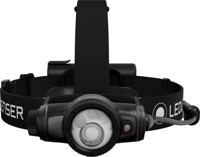 Eine schwarze Stirnlampe mit verstellbarem Band und LED-Licht vorne. Eine schwarze Stirnlampe mit verstellbarem Band und LED-Licht vorne.