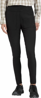 Schwarze Damenleggings mit Taschen und kariertem Hemd darüber. Schwarze Damenleggings mit Taschen und kariertem Hemd darüber.