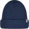 Eine marineblaue Strickmütze mit umgeschlagener Krempe und kleinem Etikett.