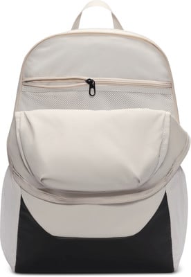 Beiger Rucksack mit schwarzem Boden und offenem Hauptfach. Beiger Rucksack mit schwarzem Boden und offenem Hauptfach.