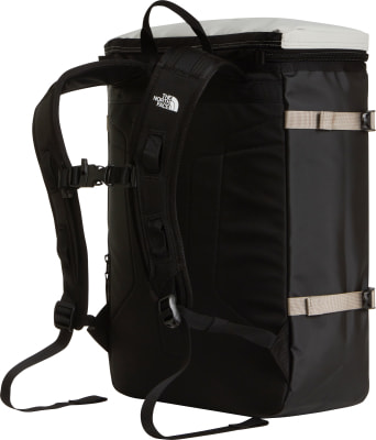 Schwarzer Rucksack mit weißer Oberseite und beige Gurten, The North Face Logo. Schwarzer Rucksack mit weißer Oberseite und beige Gurten, The North Face Logo.